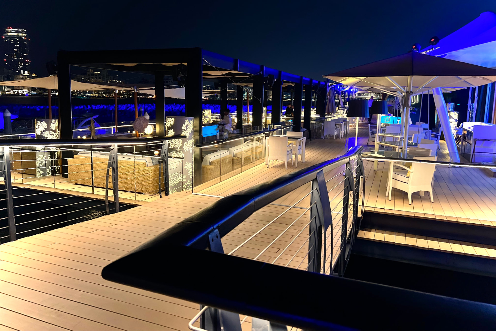 101 Dining overwater deck at night with blue lighting